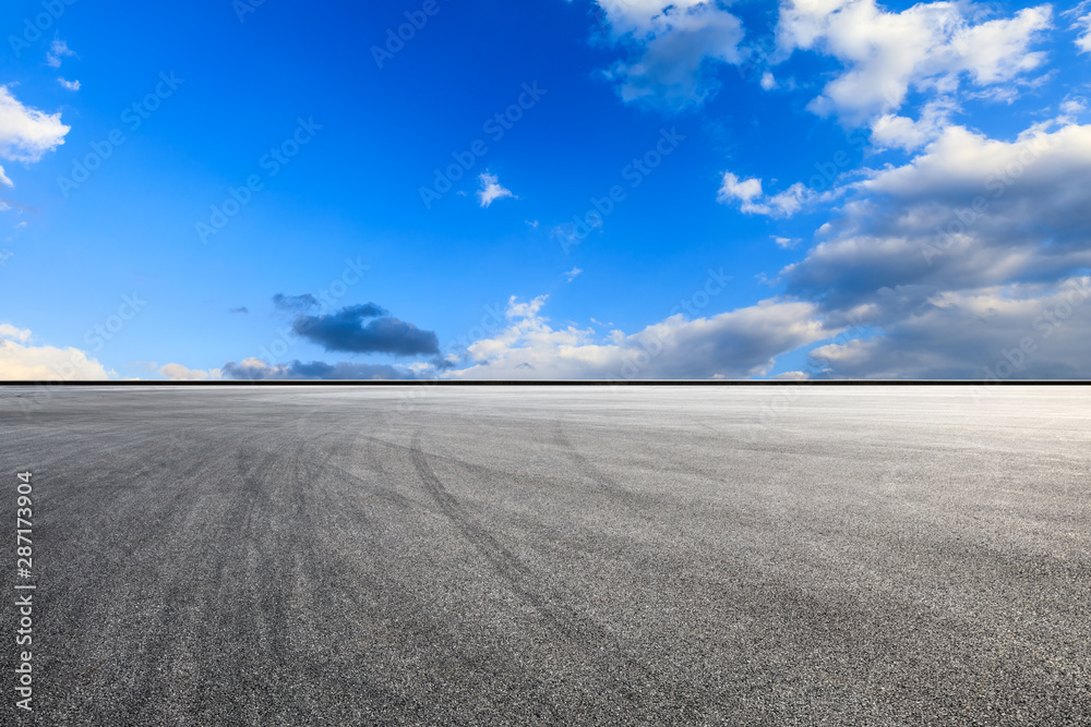 Empty race track road and beautiful sky clouds at sunset