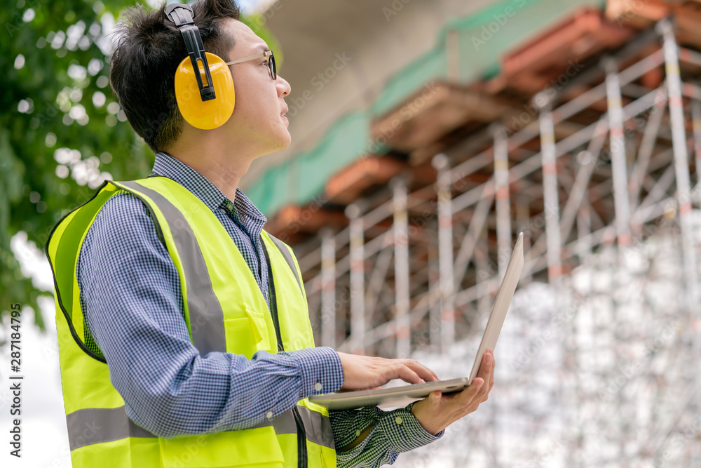 smart asian glasses engineer use radio connection working in site construction