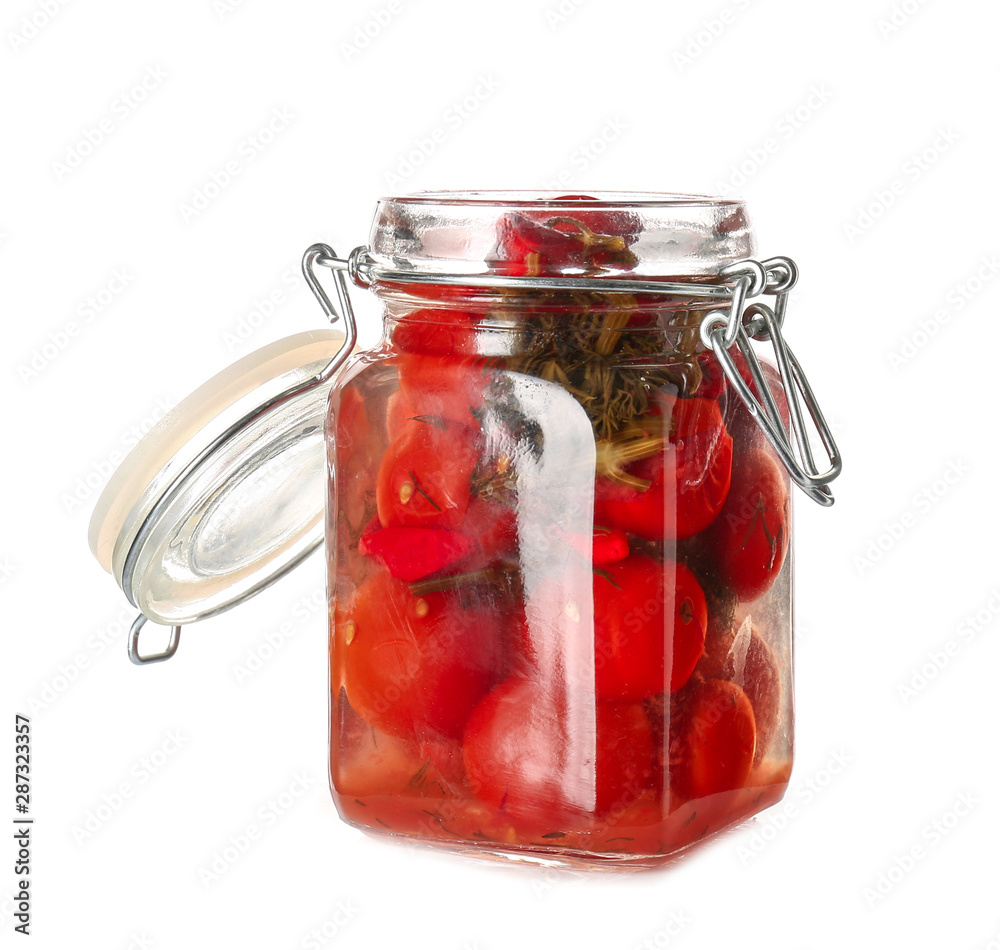 Jar with canned tomatoes and chili pepper on white background