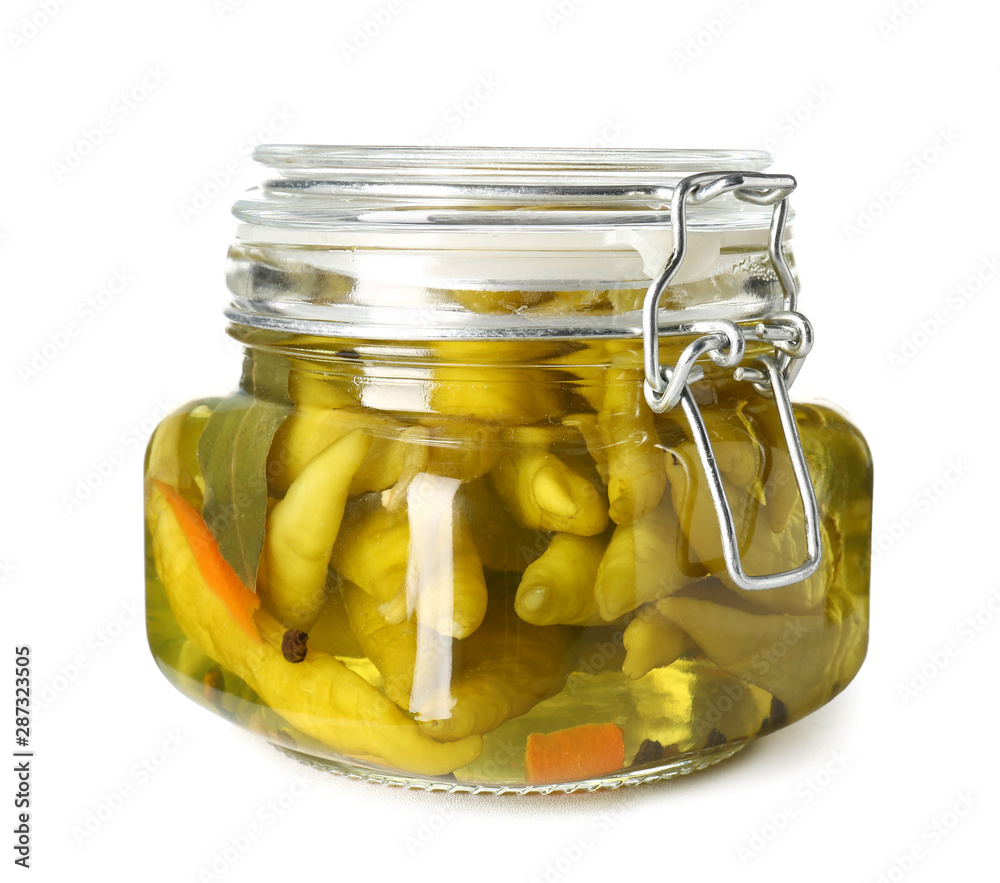 Jar with canned chili pepper on white background