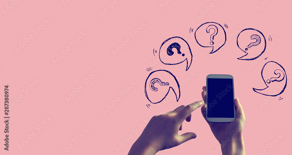 Question marks with speech bubbles with person holding a white smartphone