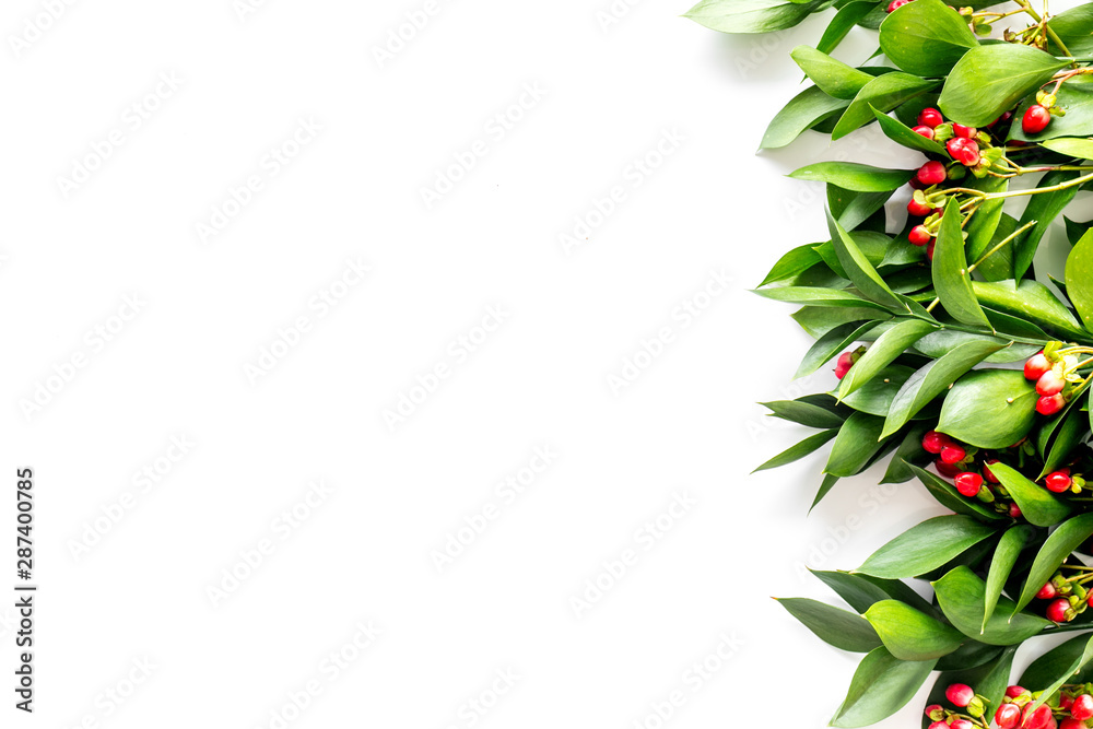 Summer pattern with green plants and red berries on white background top view mockup