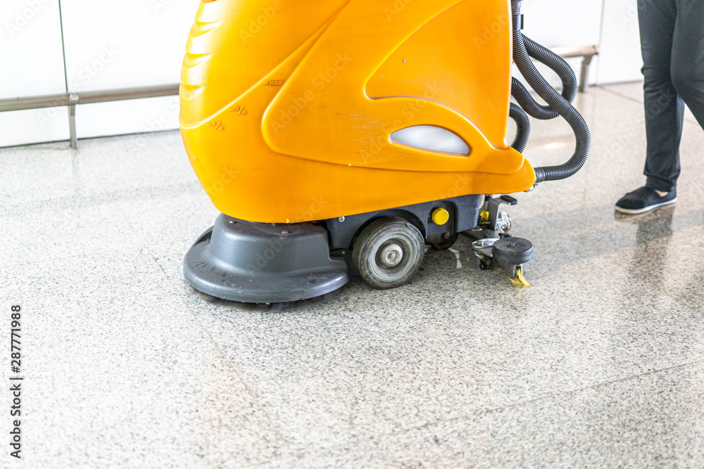 cleaning floor with machine