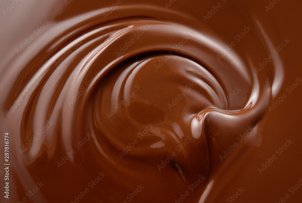 Chocolate background. Melted chocolate surface. Chocolate swirl.