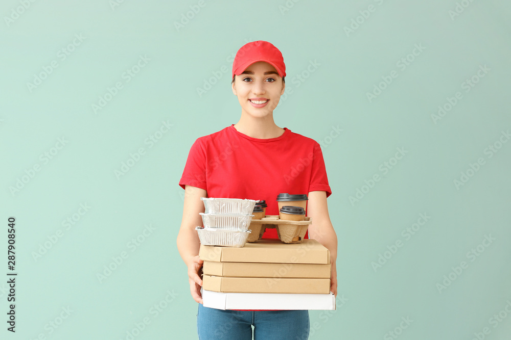 Female worker of food delivery service on color background