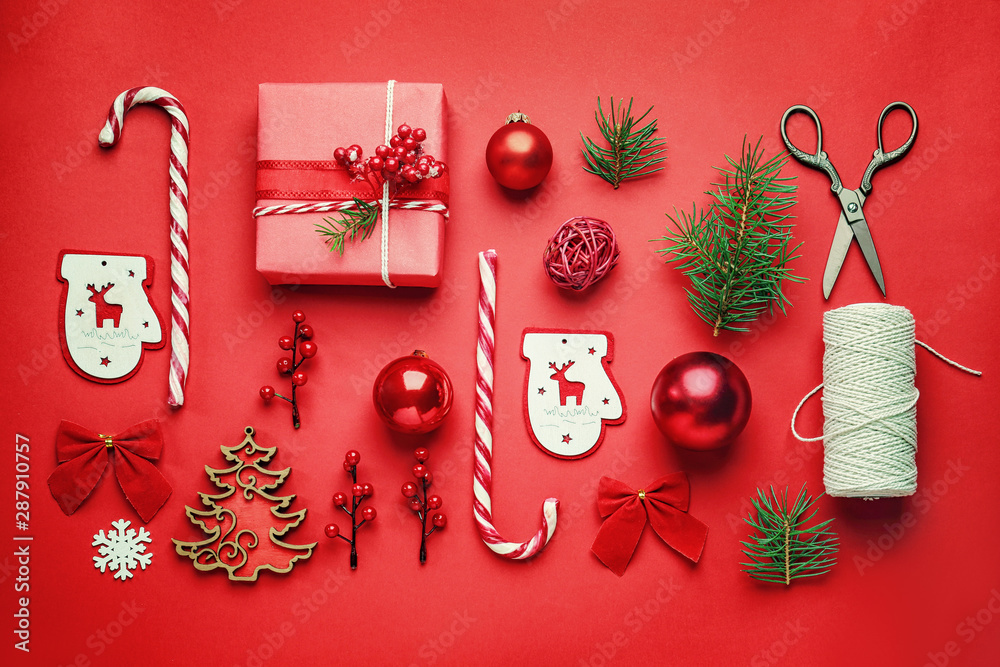 Christmas gift box with decor on color background