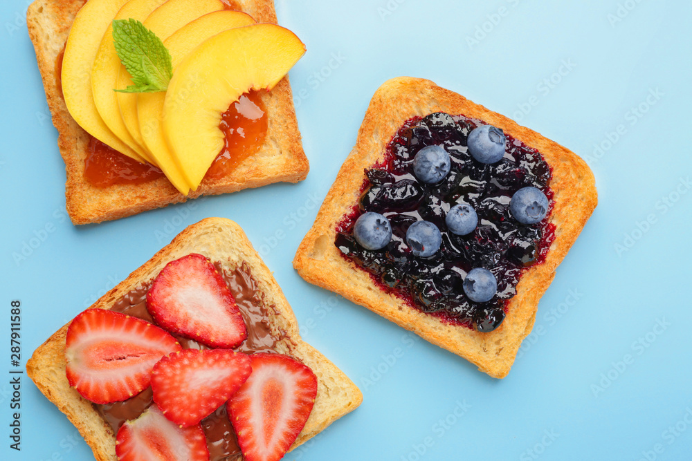 Different tasty sandwiches on color background