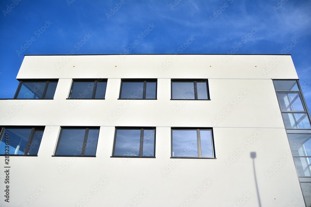 The windows of a modern building for offices. Business buildings architecture.