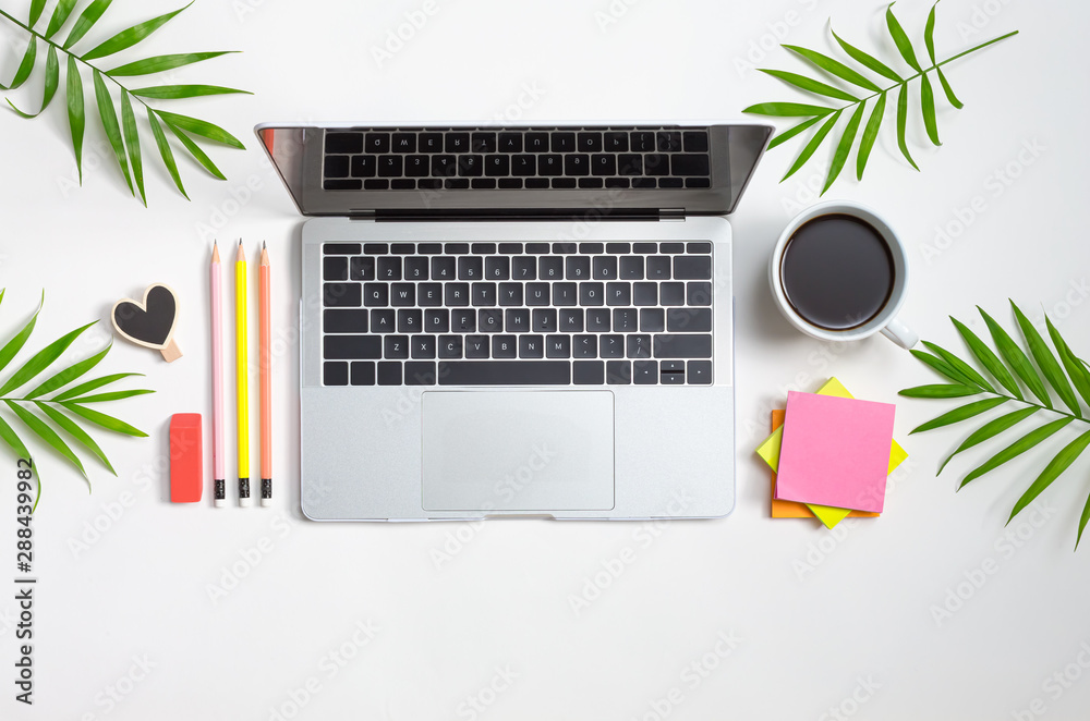 Office supplies with a laptop computer on a table