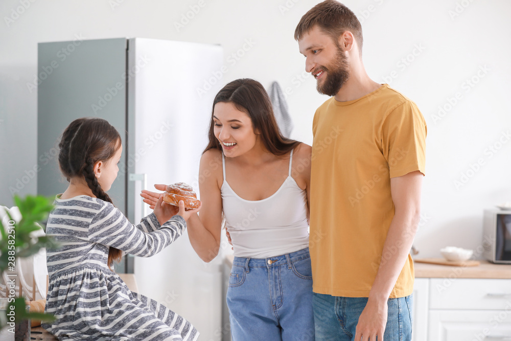 Young family together in kitchen