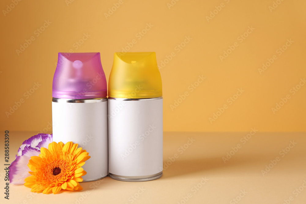 Air fresheners on color background