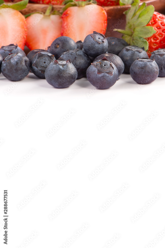 A bowl set of beautiful and delicious strawberry and blueberry isolated on white background, close u