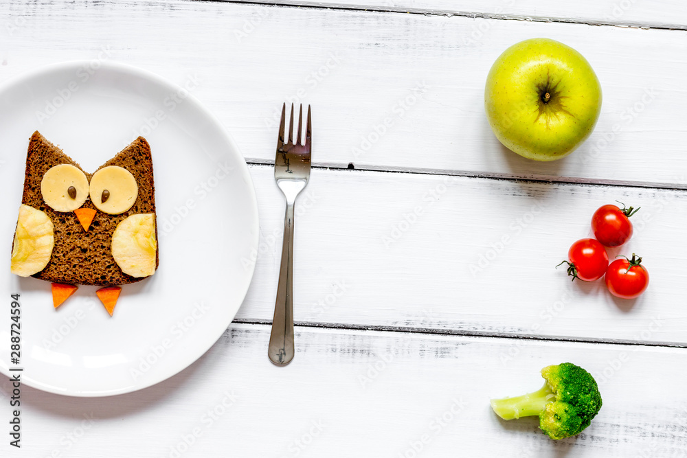 kids menu owl shaped sandwich with vegetables and fruits