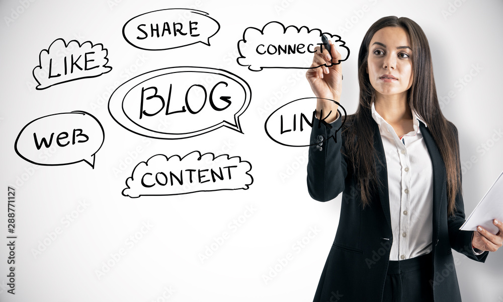 Blogging concept with woman drawing business scheme at light wall background.