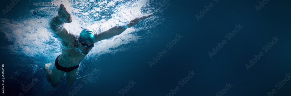 Fit swimmer training by himself