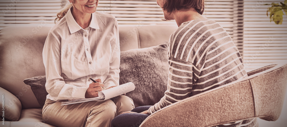 Smiling therapist with patient