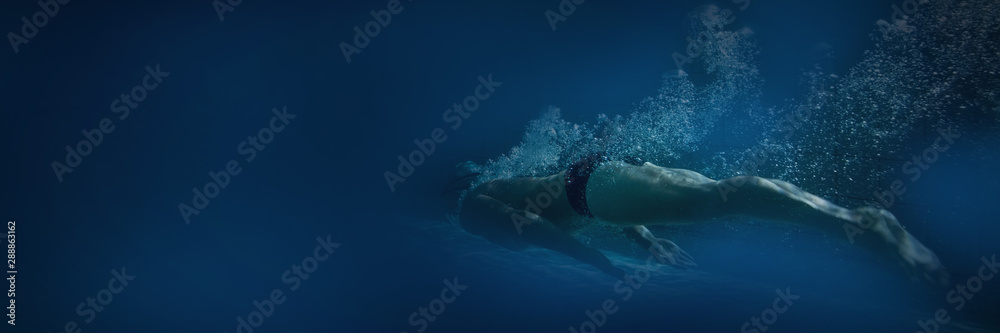 Fit swimmer training by himself