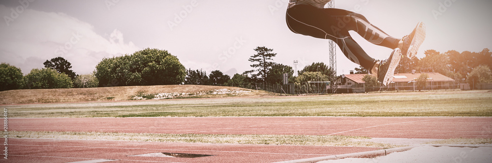 Athlete performing a long jump