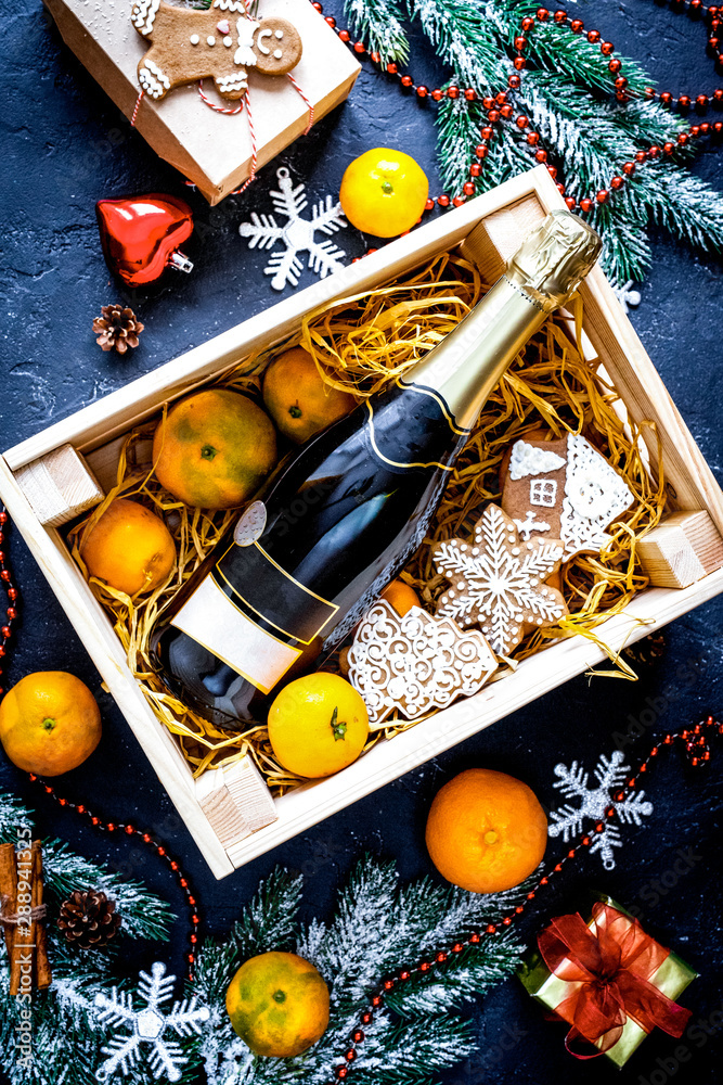 New Years champagne and tangerines in box top view