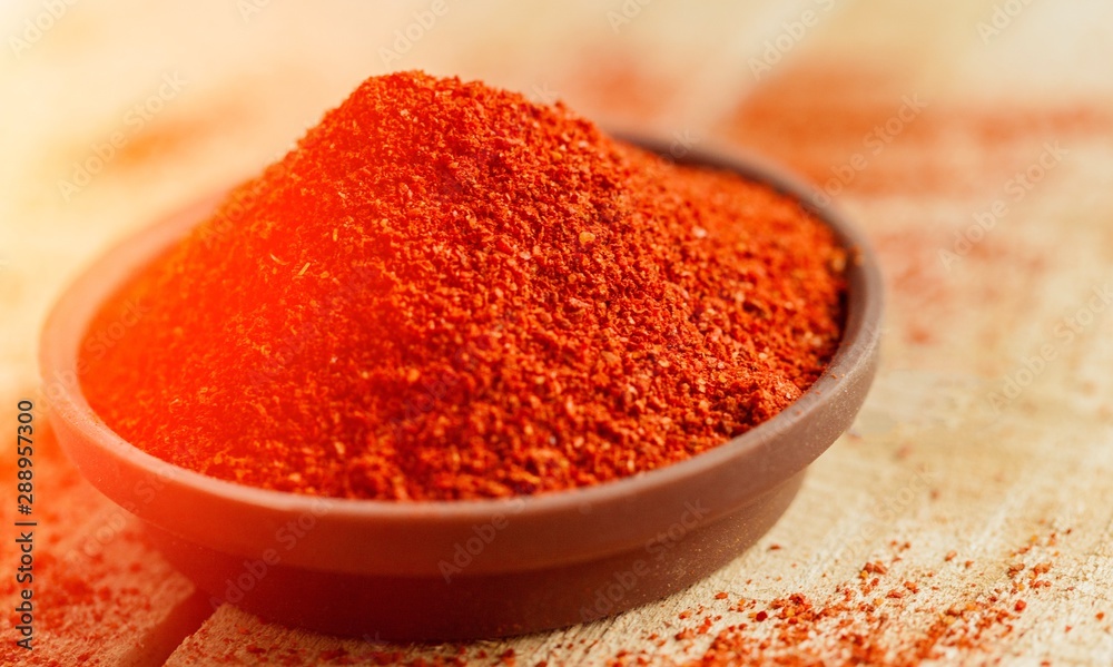 Aprika powder in wooden bowl