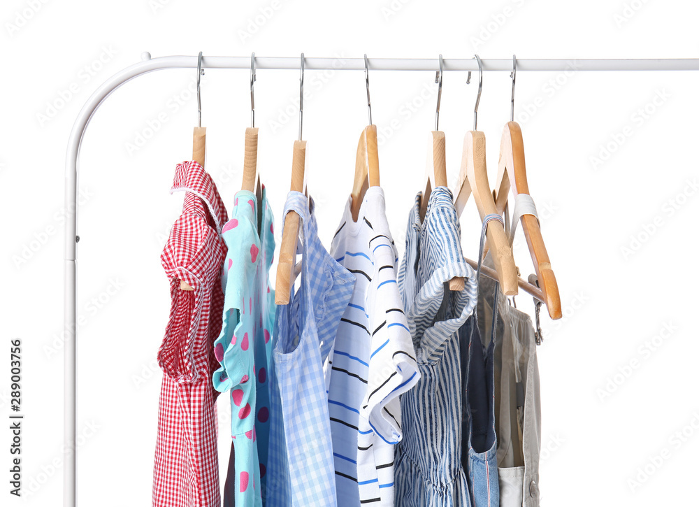 Rack with hanging clothes on white background