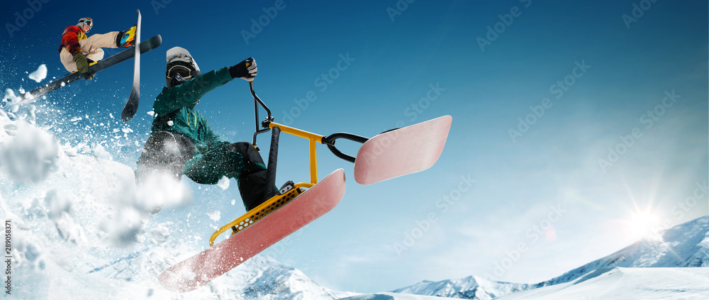 Skiing, snow scoot, snowboarding.  Extreme winter sports.