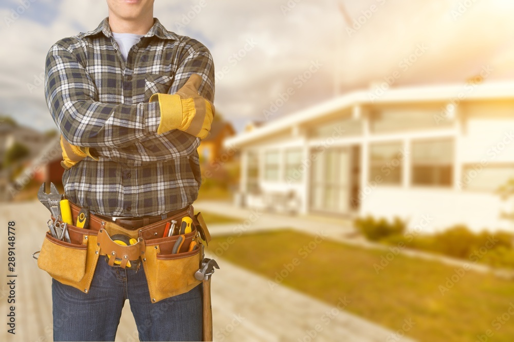 Worker with a tool belt. Isolated over white background.