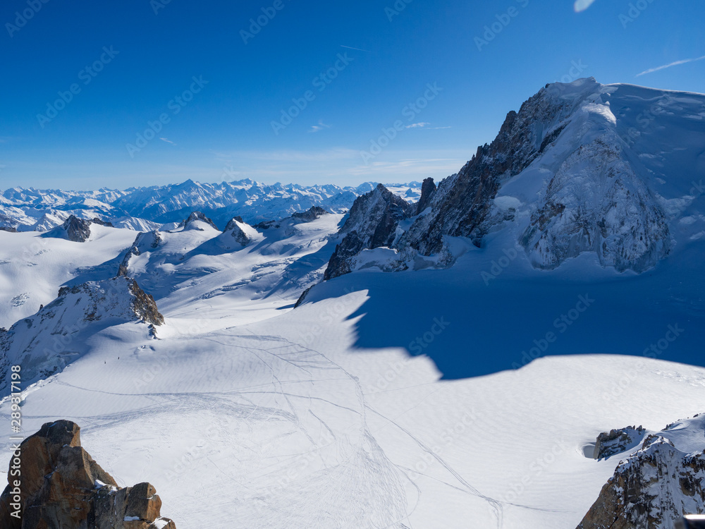 France, january 2018: View on Chamonix Valley from top of Aiguille du Midi summit on a sunny winter 