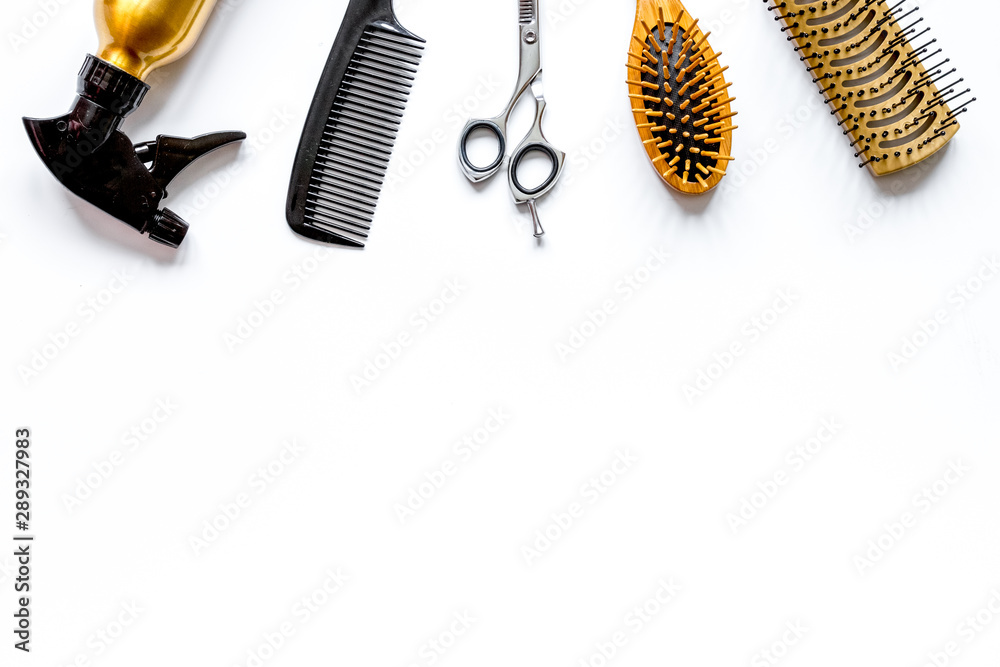 combs and hairdresser tools on white background top view