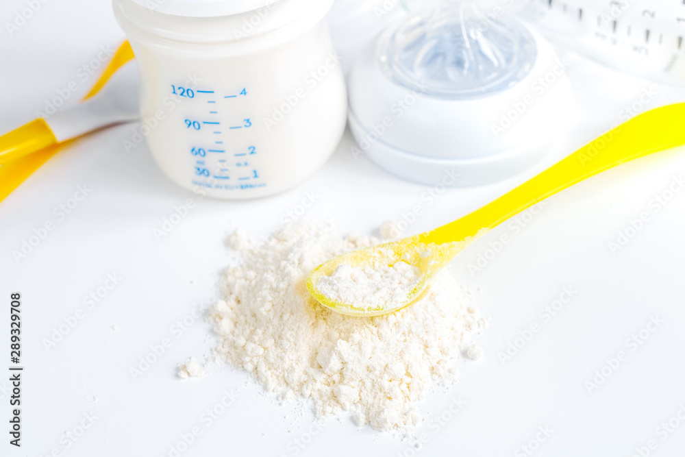 preparation of mixture baby feeding on white background