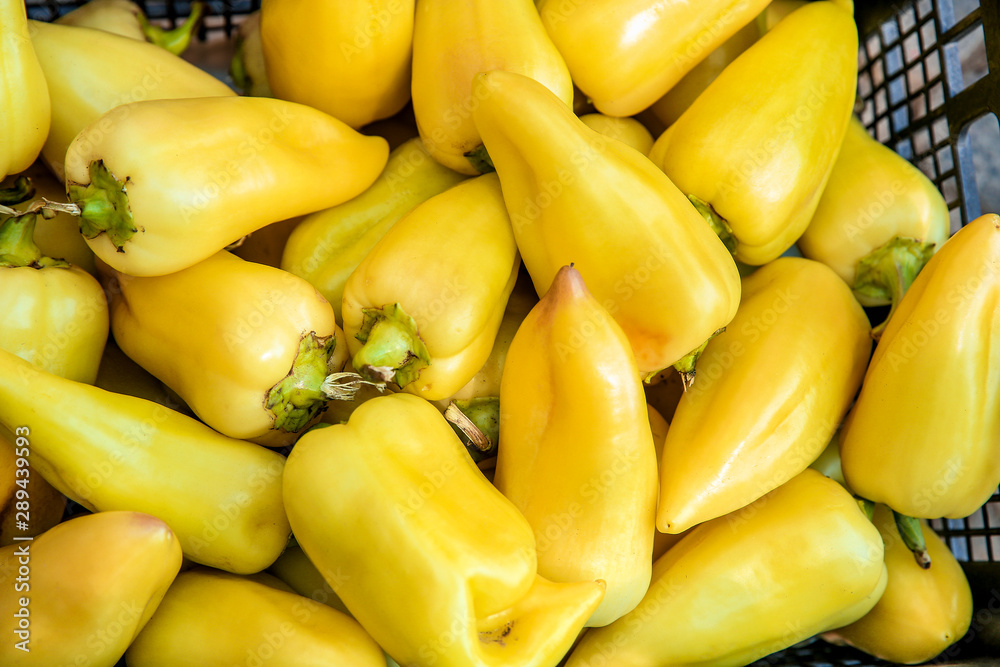 Fresh bell peppers in basket at market