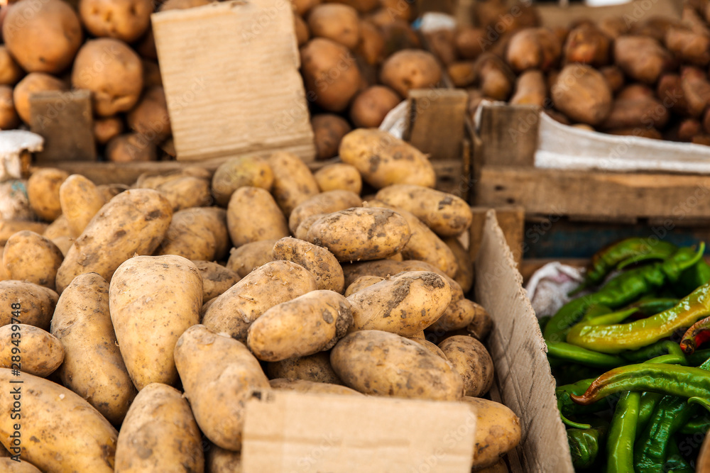 Fresh potatoes on counter at market