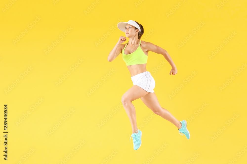 Running female tennis player on color background