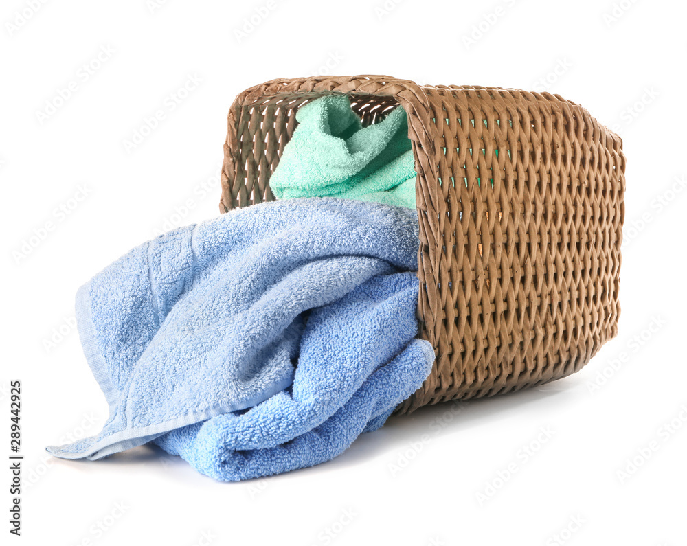 Basket with laundry on white background