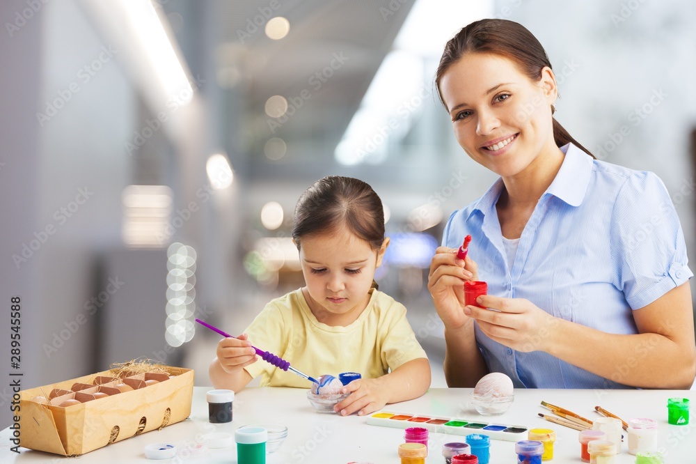 Happy Mother and daughter drawing