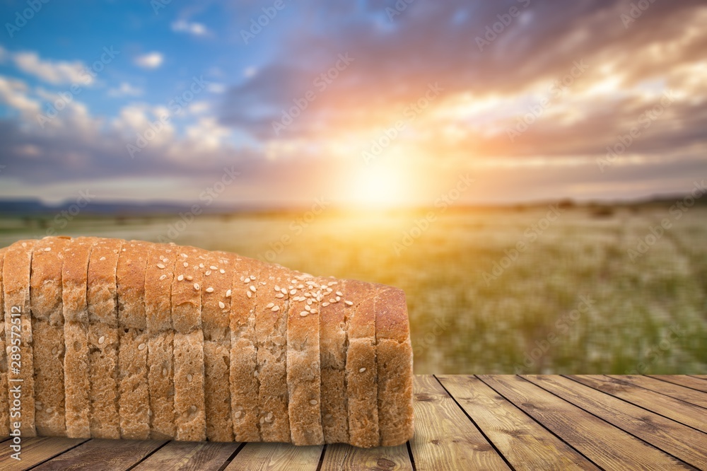 Tasty sliced bread on background