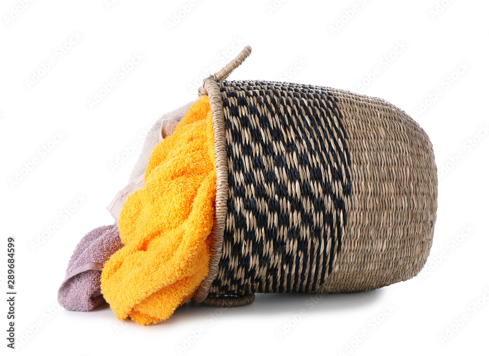 Basket with laundry on white background