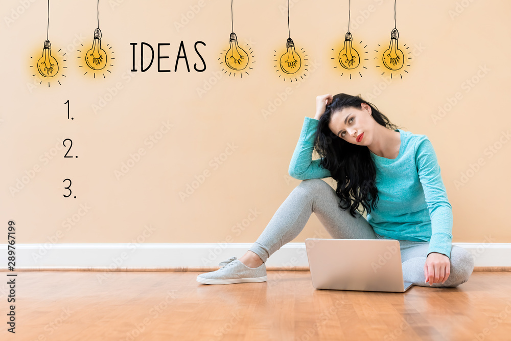 Idea list with young woman using a laptop computer