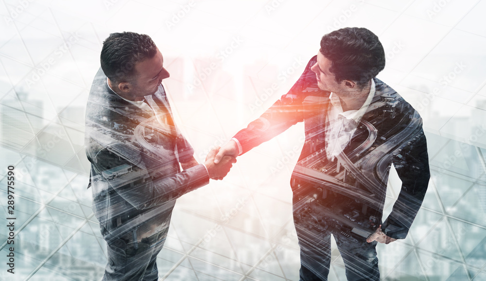 Double exposure image of business people handshake on city office building in background showing par