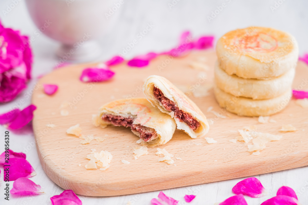 Fresh flower cake of Yunnan, China on the cutting board 