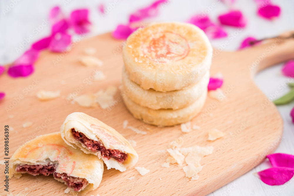 Fresh flower cake of Yunnan, China on the cutting board 