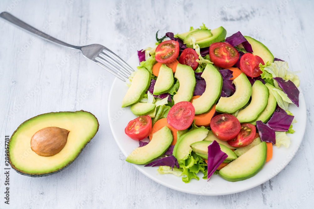 Healthy weight loss food: A plate of avocado and vegetable salad 