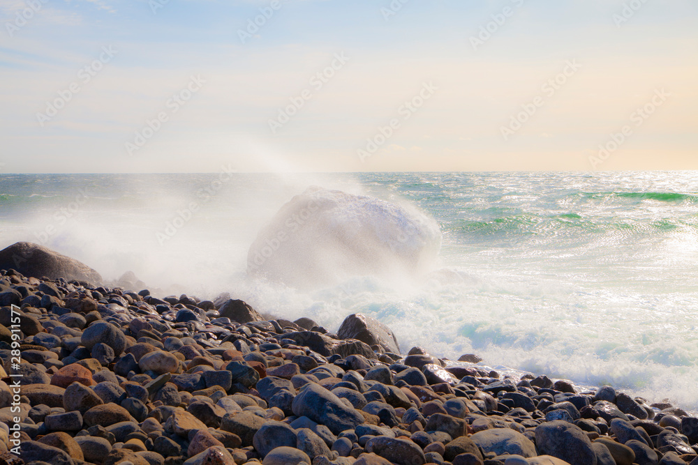 Large waves hit a rocky coastline in Norway