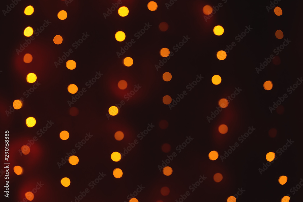 Abstract blurred shiny bokeh lights black background