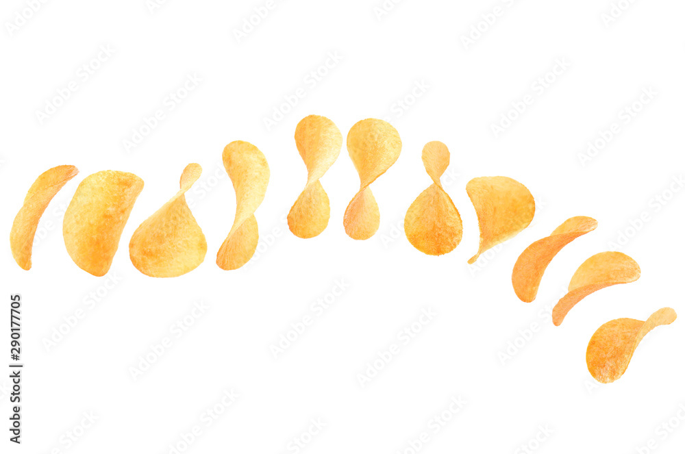 Falling crispy potato chips on white background