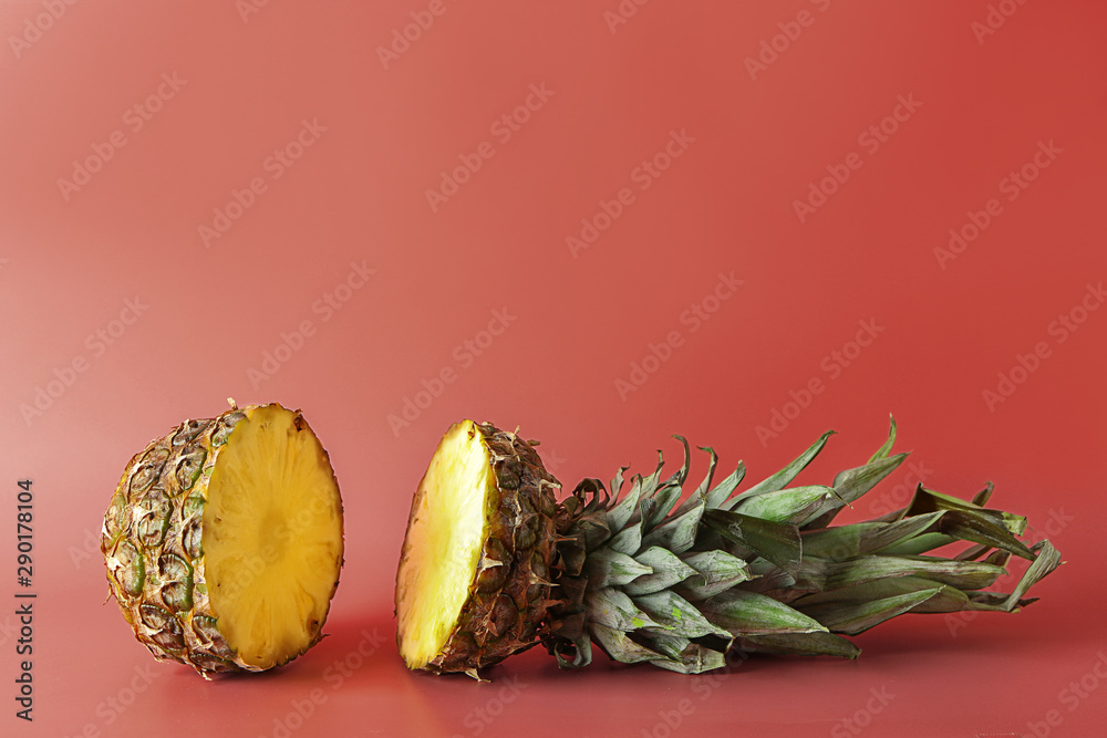 Ripe cut pineapple on color background