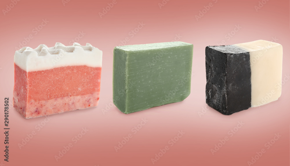 Different soap bars on color background