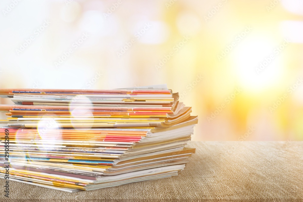 Pile of newspapers on white background