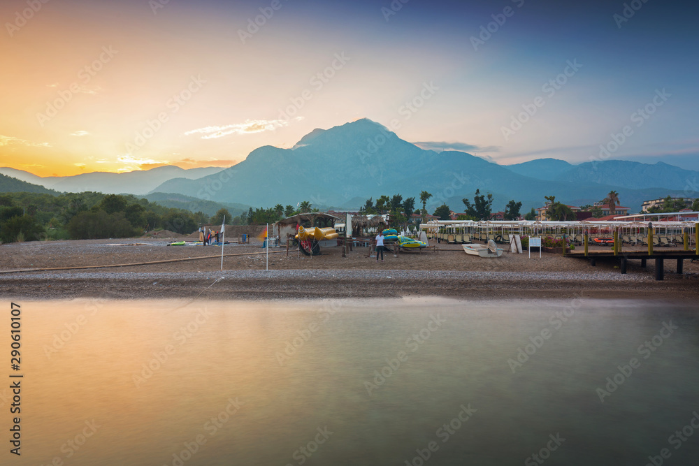 Amazing sunset on the coast of Turkish Riviera with Mount Tahtali in background, Tekirova