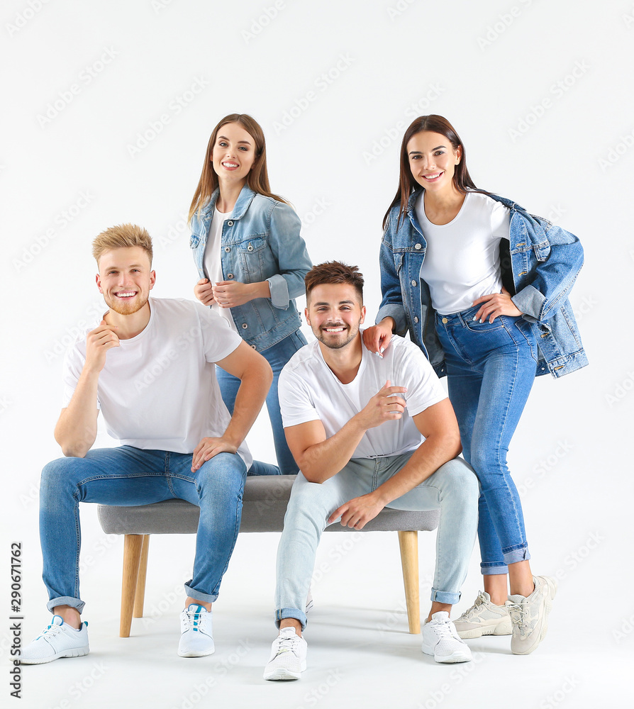 Group of young people in stylish casual clothes on white background